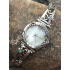 A Round Face Watch with Swirls and Little Opals